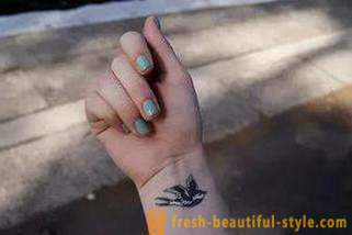 Женска тетоважа на руци: атрактивна израз